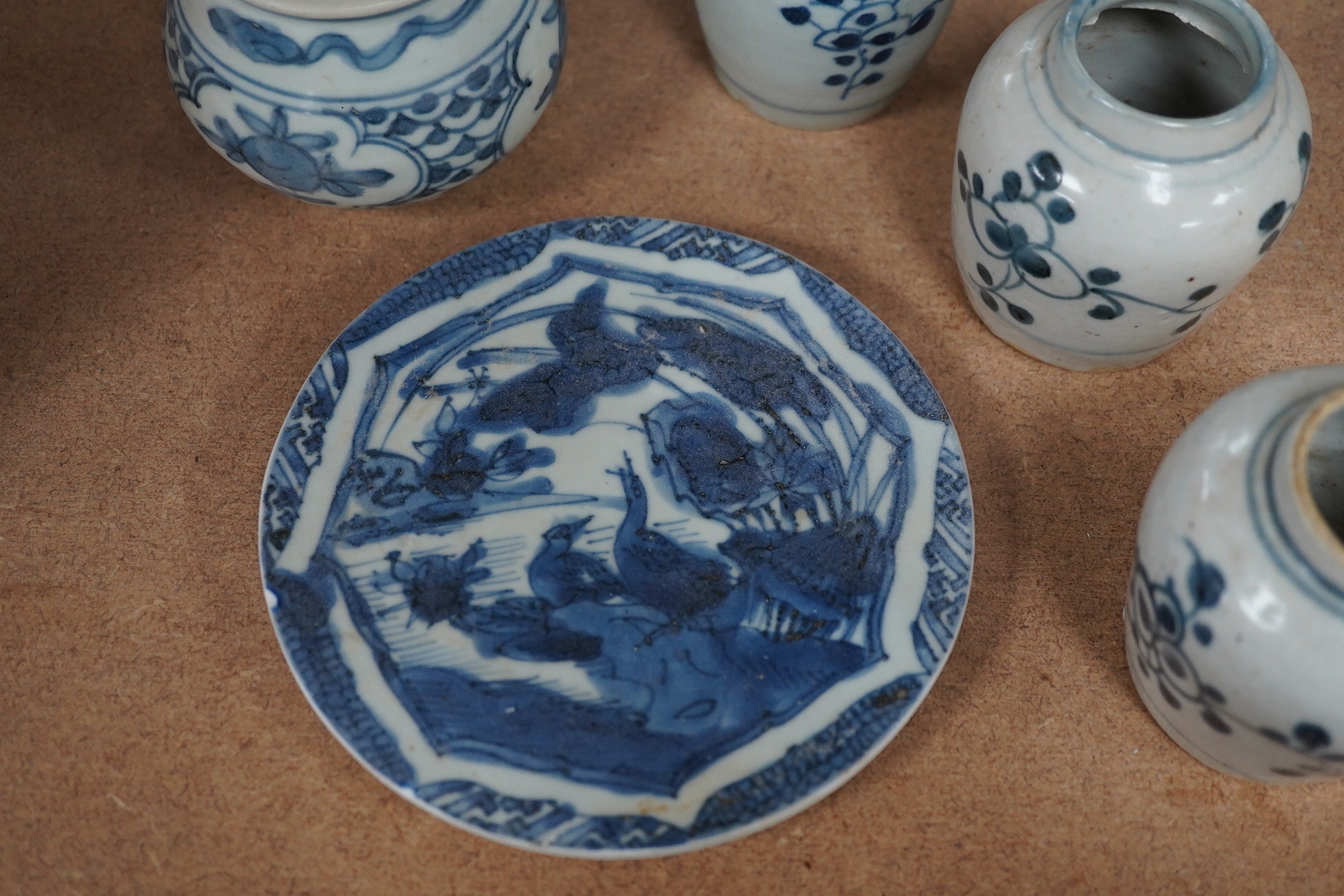 Three Chinese blue and white jars and a dish centre, late Ming dynasty, largest 13cm in diameter. Condition - fair